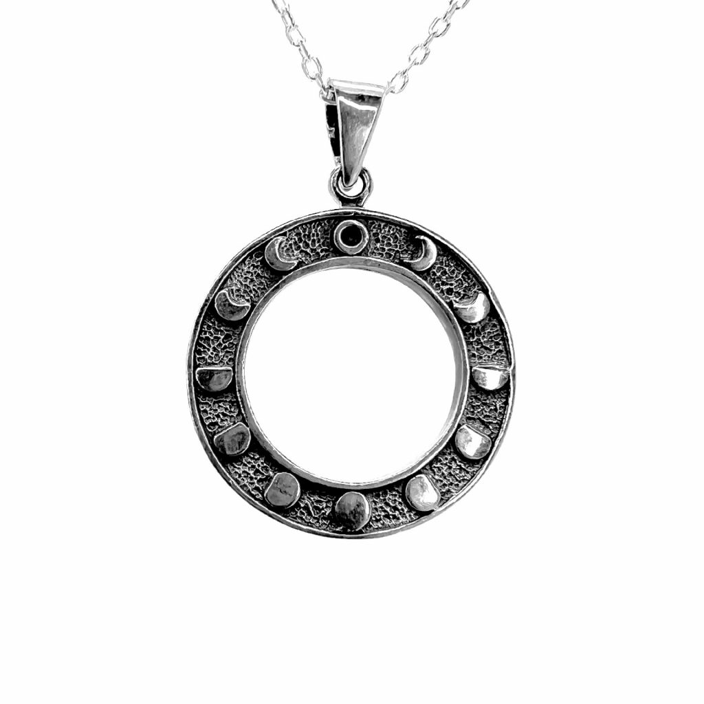 The Moon Phase Pendant by County Argyle hand-cast in sterling silver