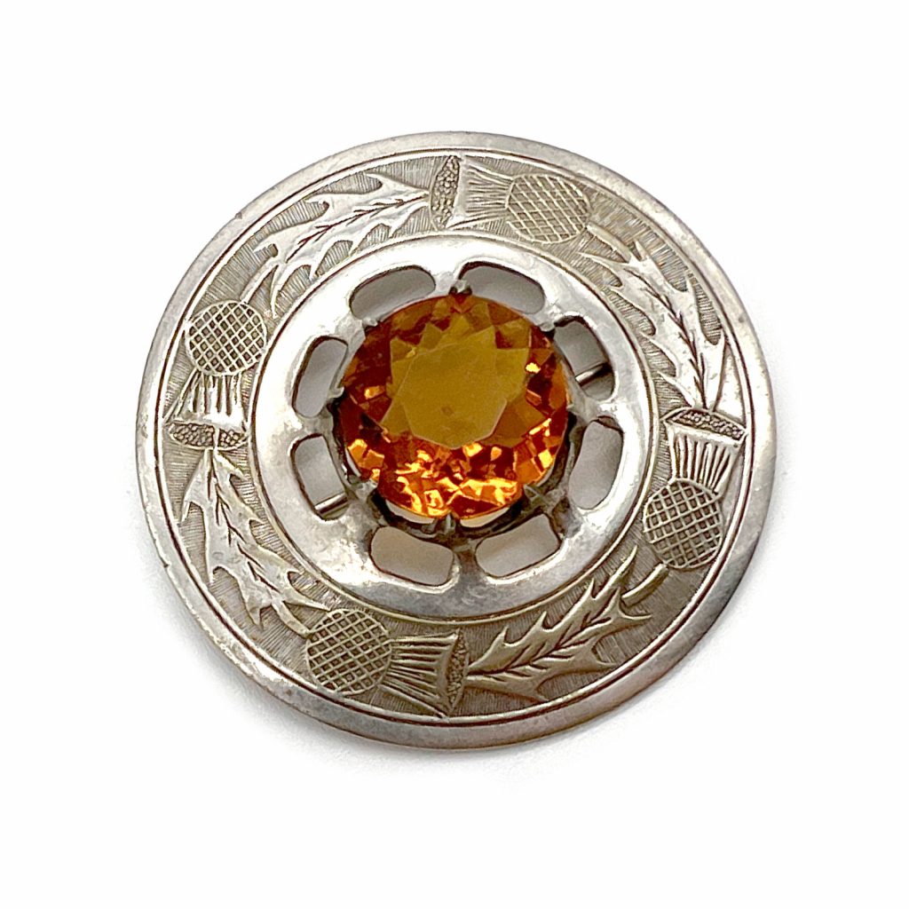 A Mid-Century Citrine Thistle Kilt Pin
